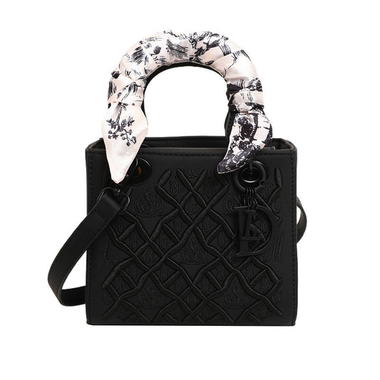 Elegant Embossed Handbag with Scarf Detail