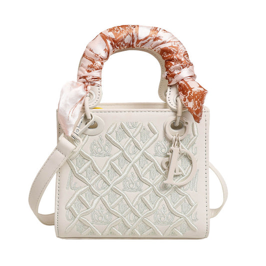 Elegant Embossed Handbag with Scarf Detail