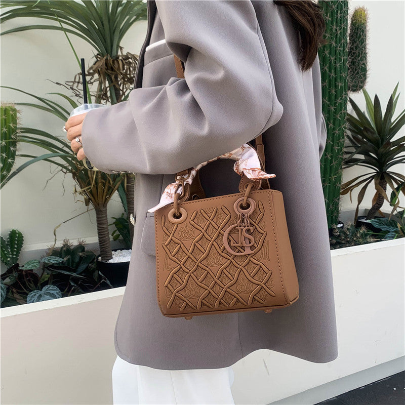 Elegant Embossed Handbag with Scarf Detail