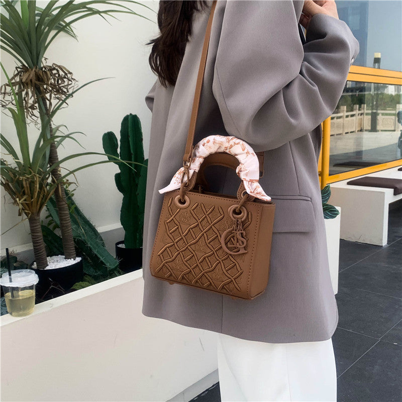 Elegant Embossed Handbag with Scarf Detail