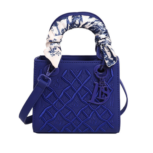 Elegant Embossed Handbag with Scarf Detail